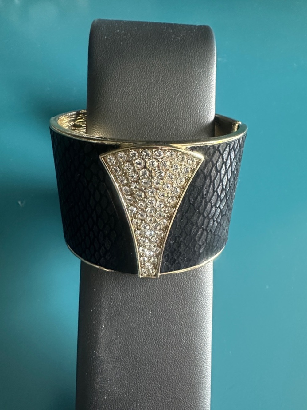 Faux black leather and rhinestone babble cuff bracelet with gold color trim